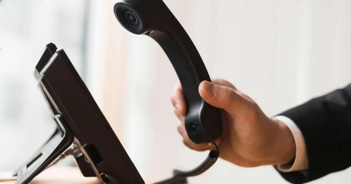 businessman holding headset scaled